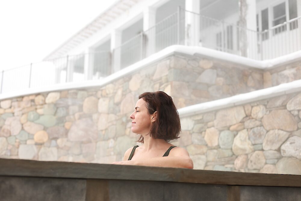 A woman bathing in a hot tub.