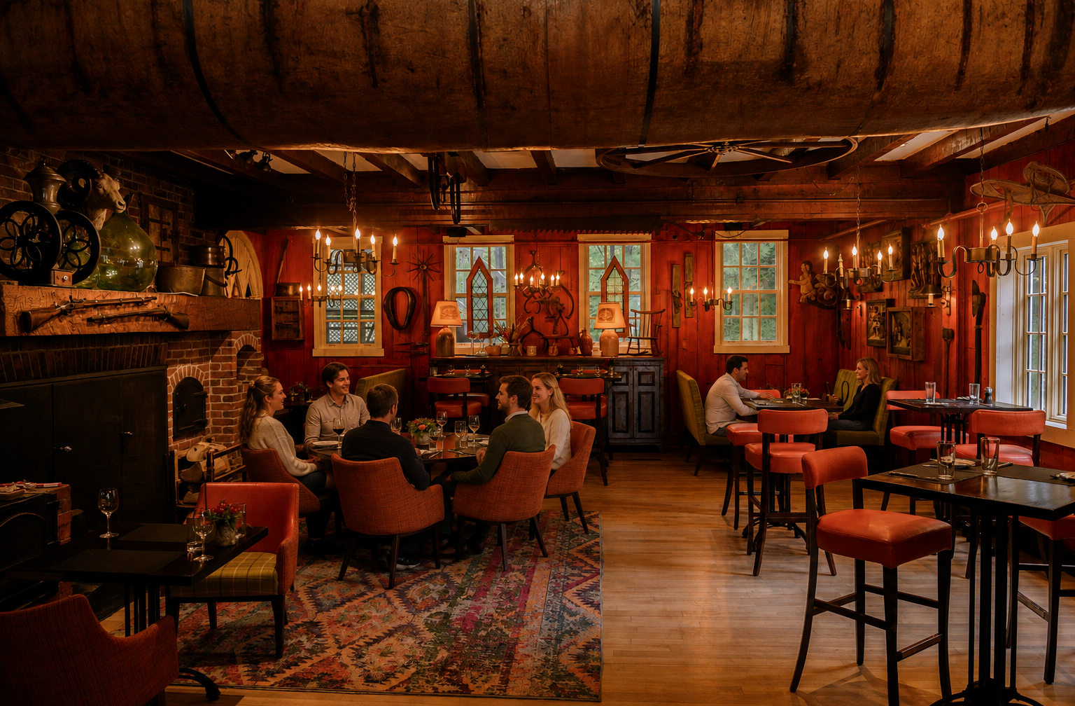 Guests gather for dinner in the warm, rustic setting of Le Tap Room.