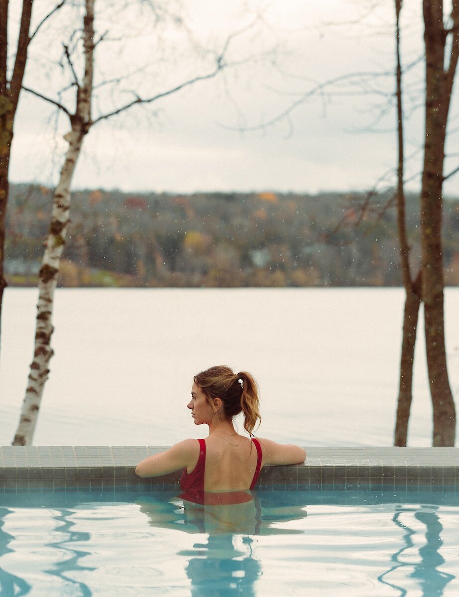 A woman in the lakeside pool