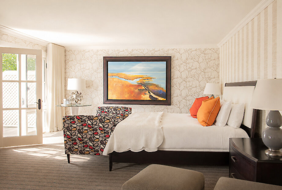 Spacious suite with a fireplace and balcony with a lakeview