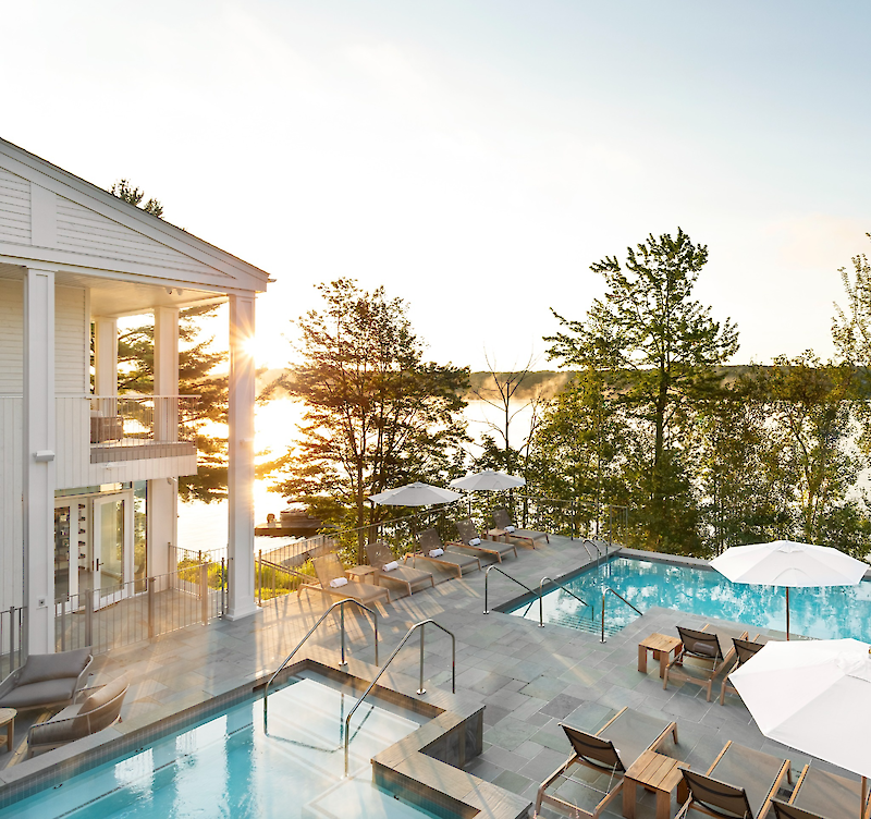 Lakefront infinity pool at sunrise