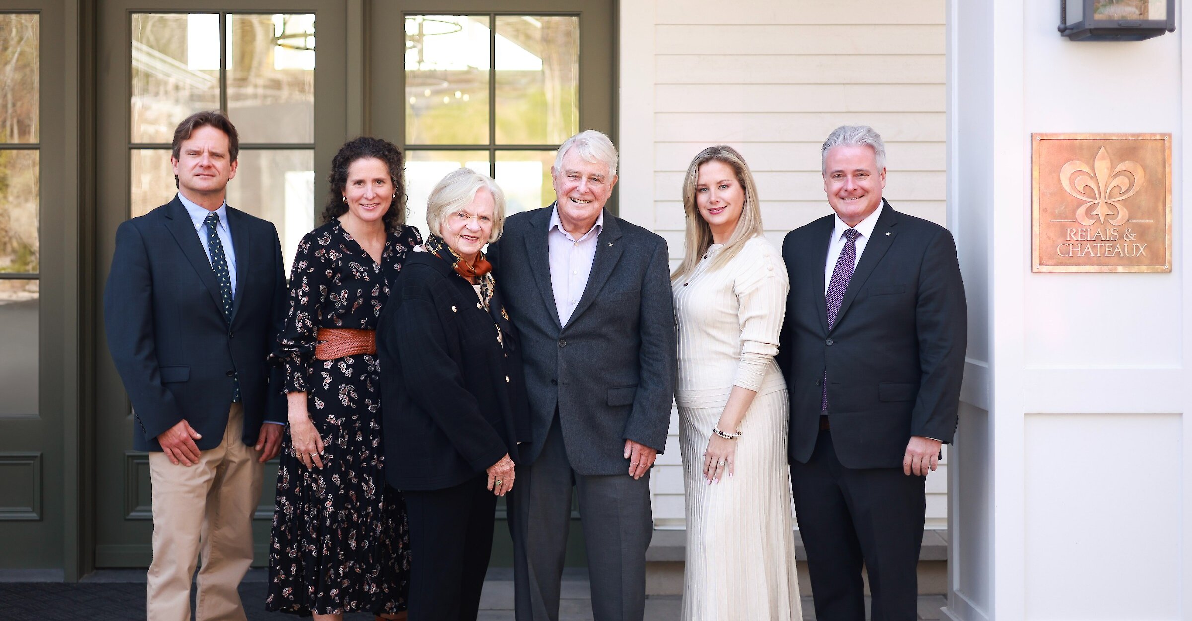 The Stafford family in front of the hotel entrance