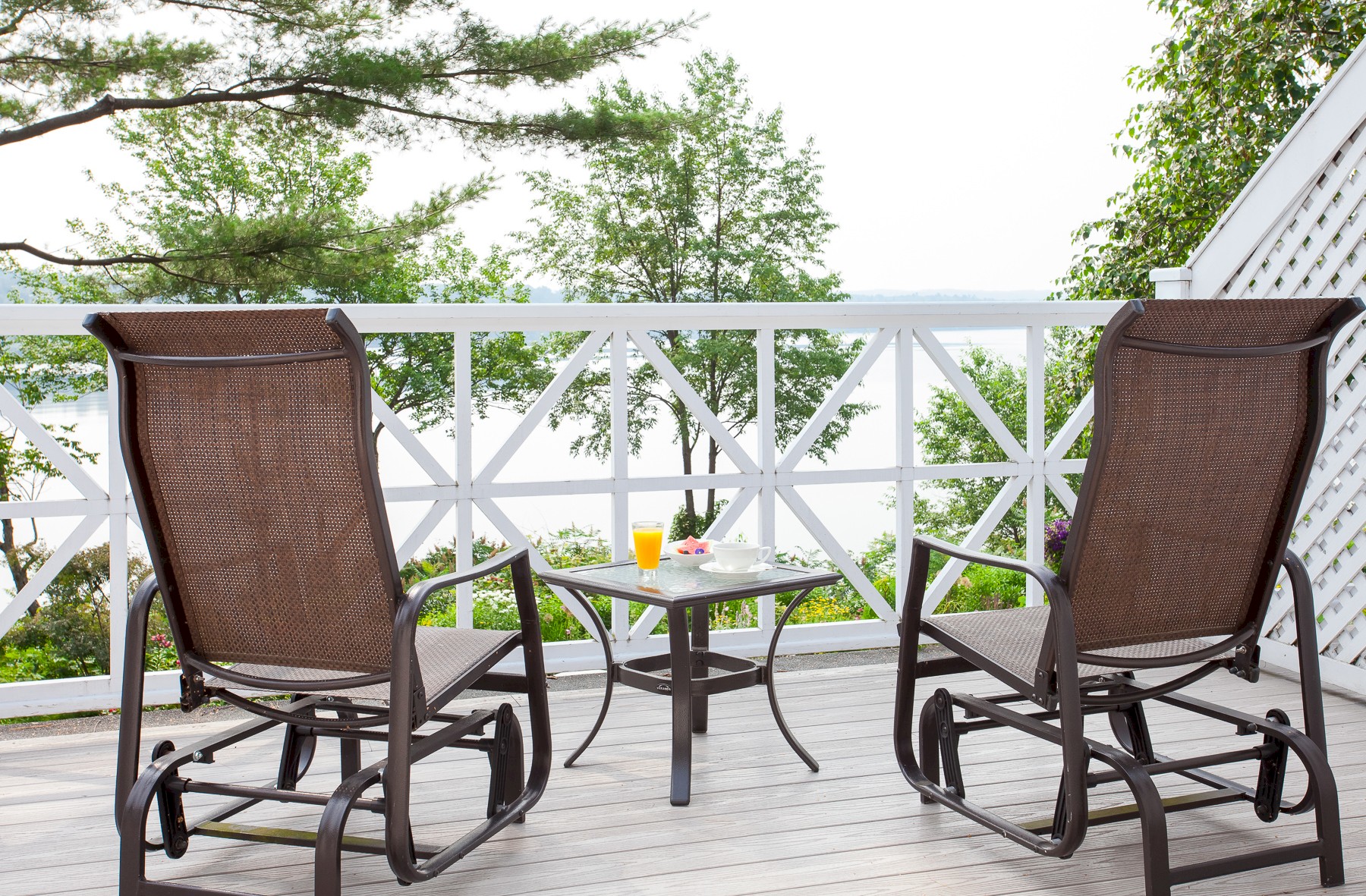 Two chairs on the balcony overlooking the lake