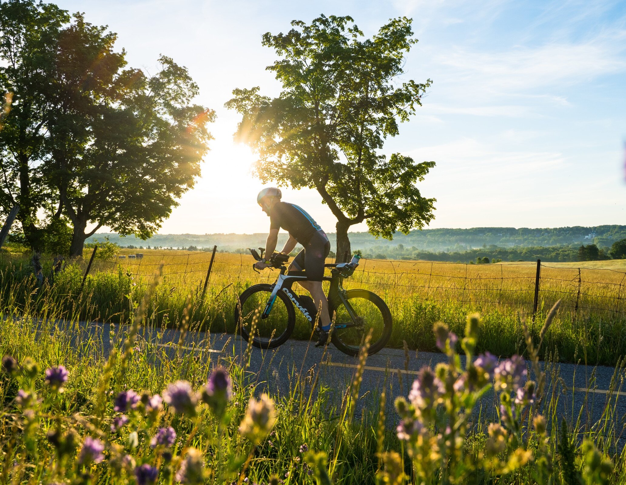 A man riding a bike in the great outdoors.