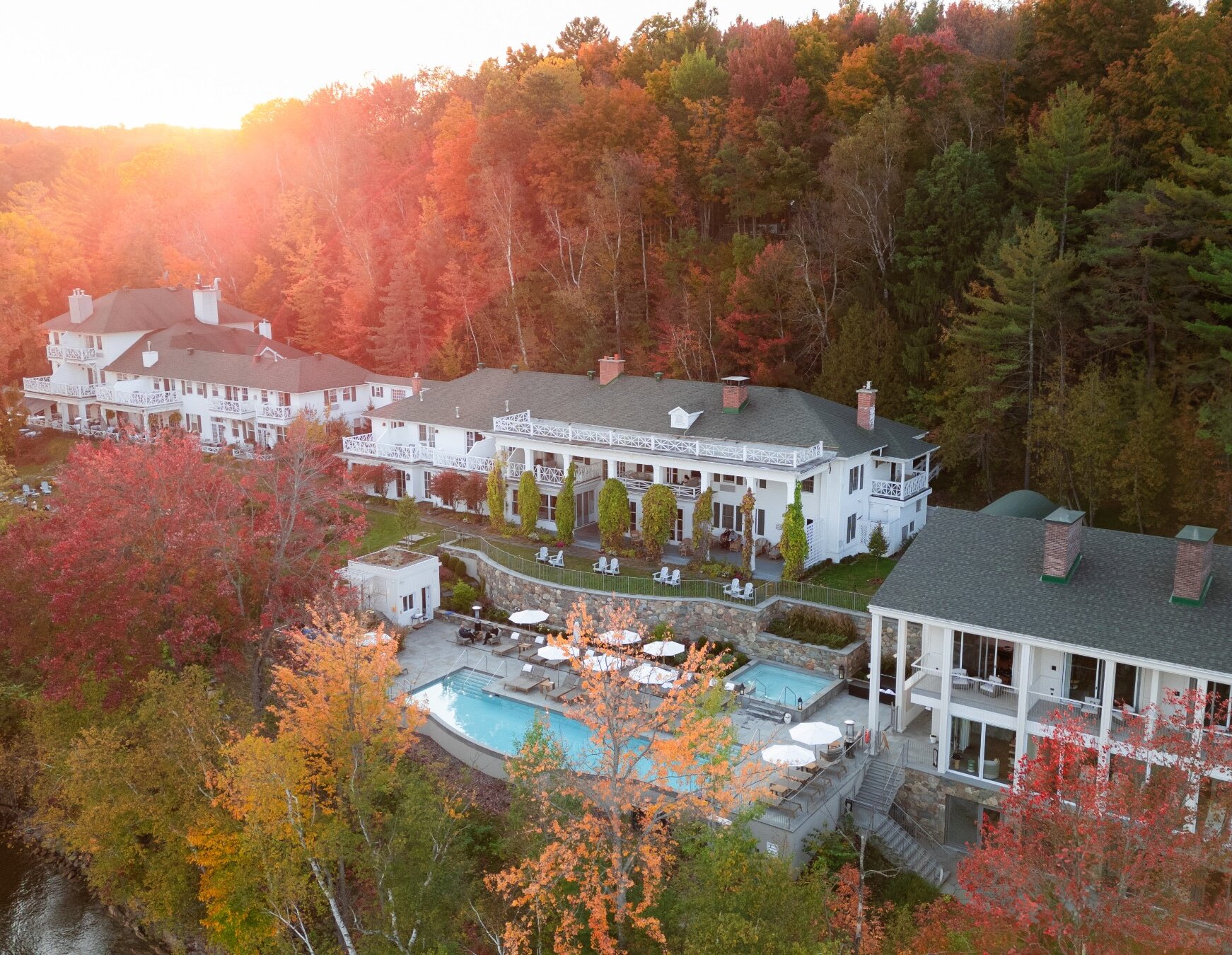 Aerial view of a lakeside pool in the fall.