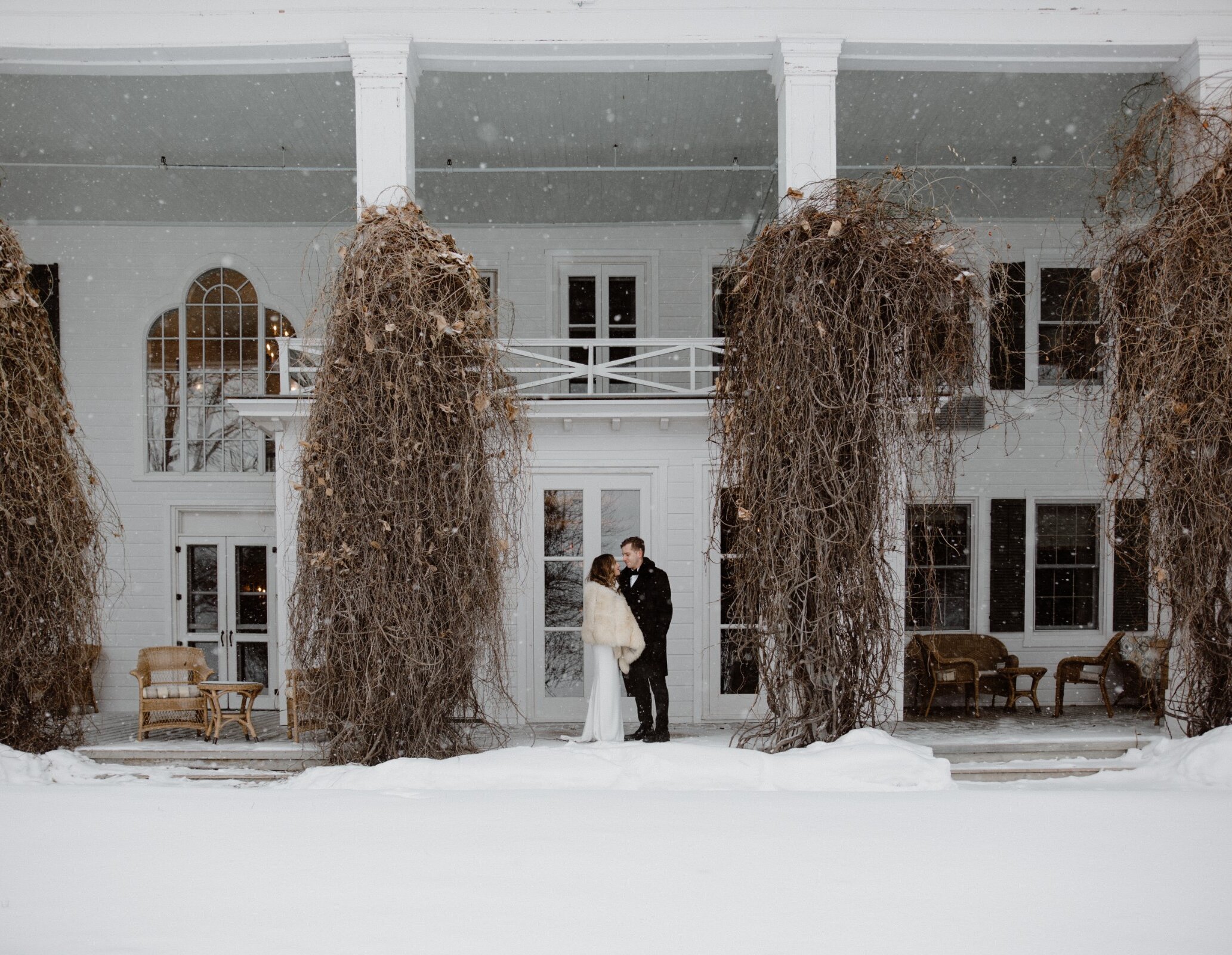 View of the front of the property in winter under the snow