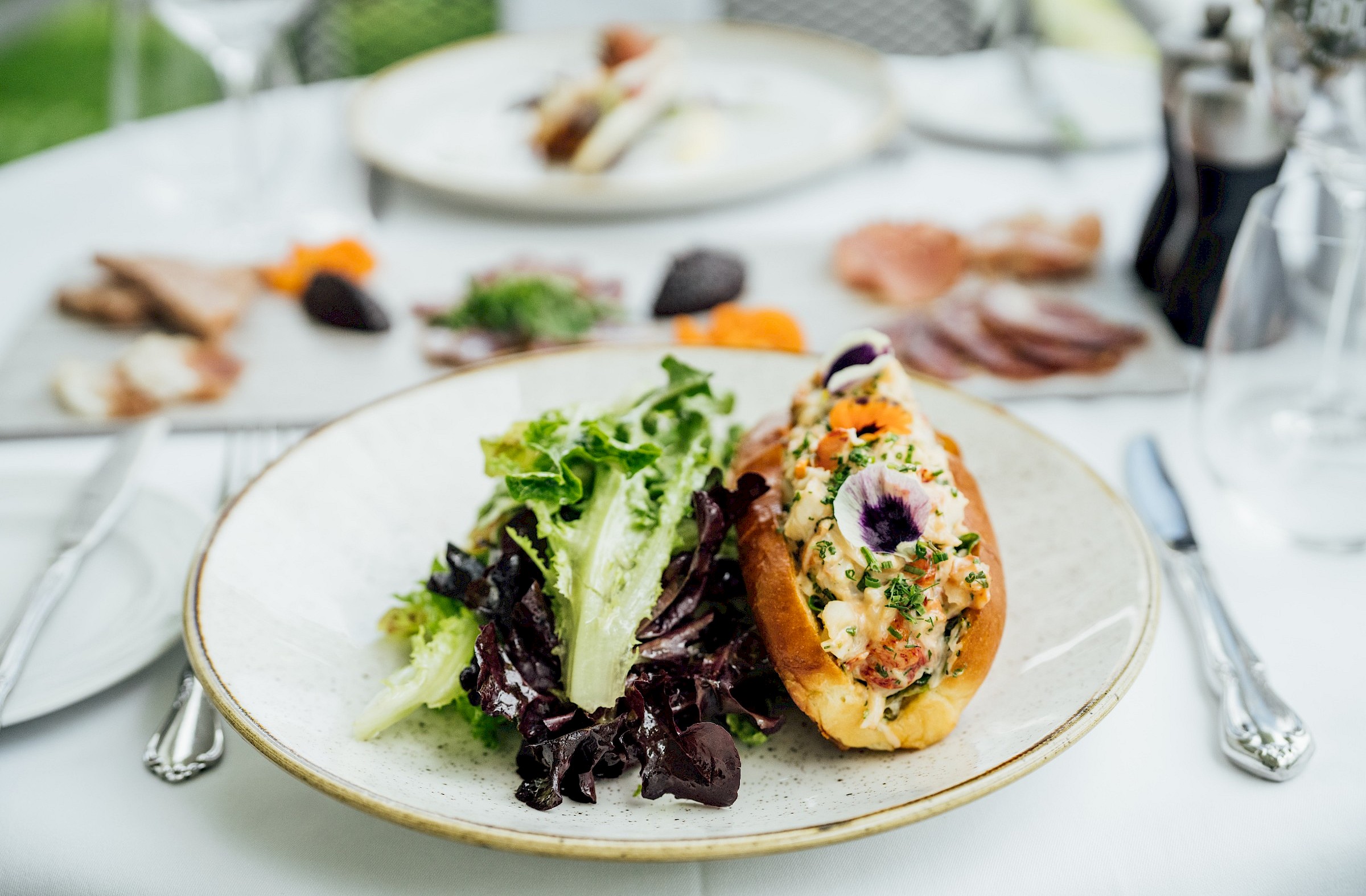 Lobster roll on a bistro terrace table