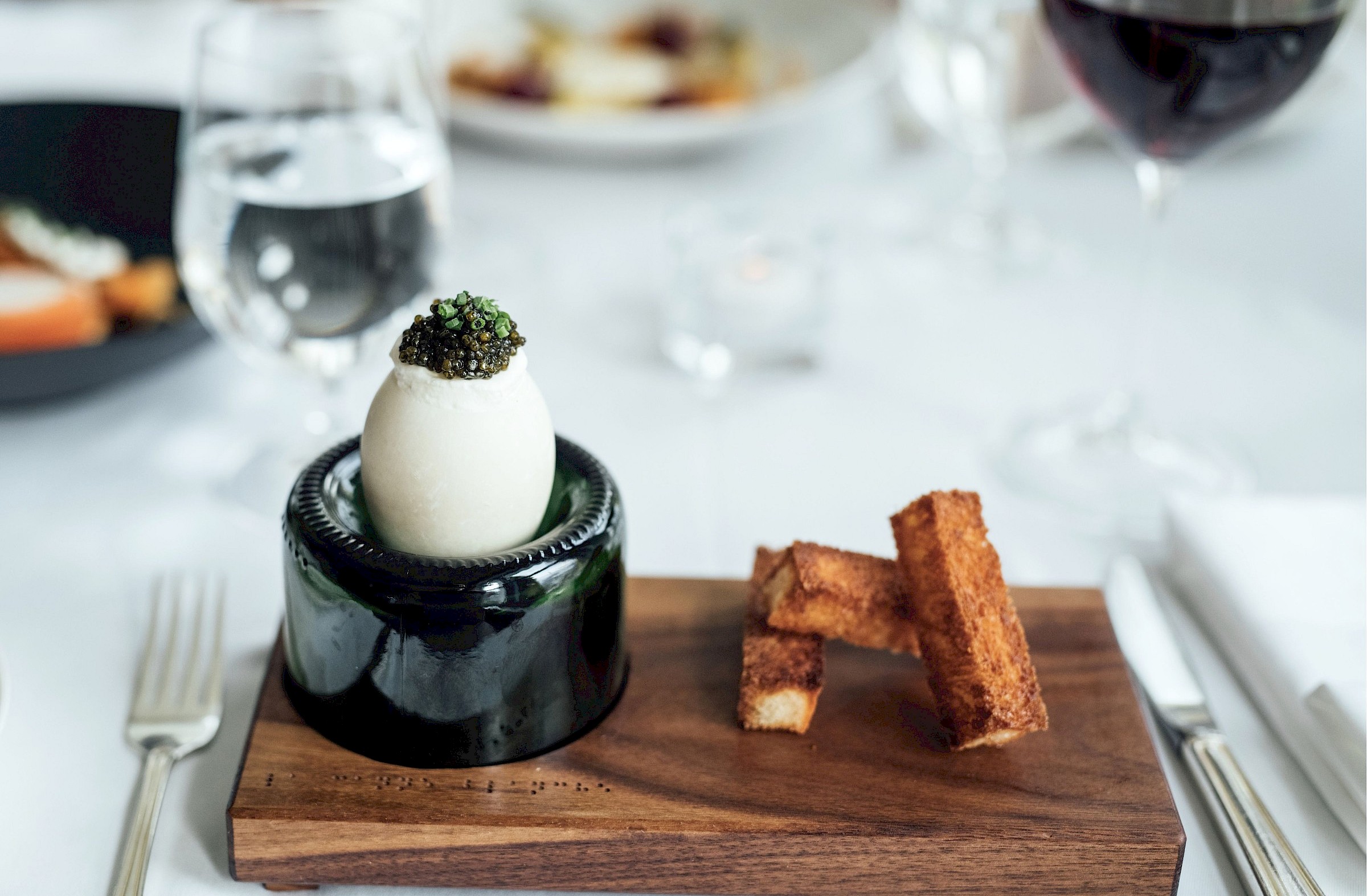 Duck egg on a wooden slab in the restaurant