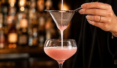 A cocktail on a bar