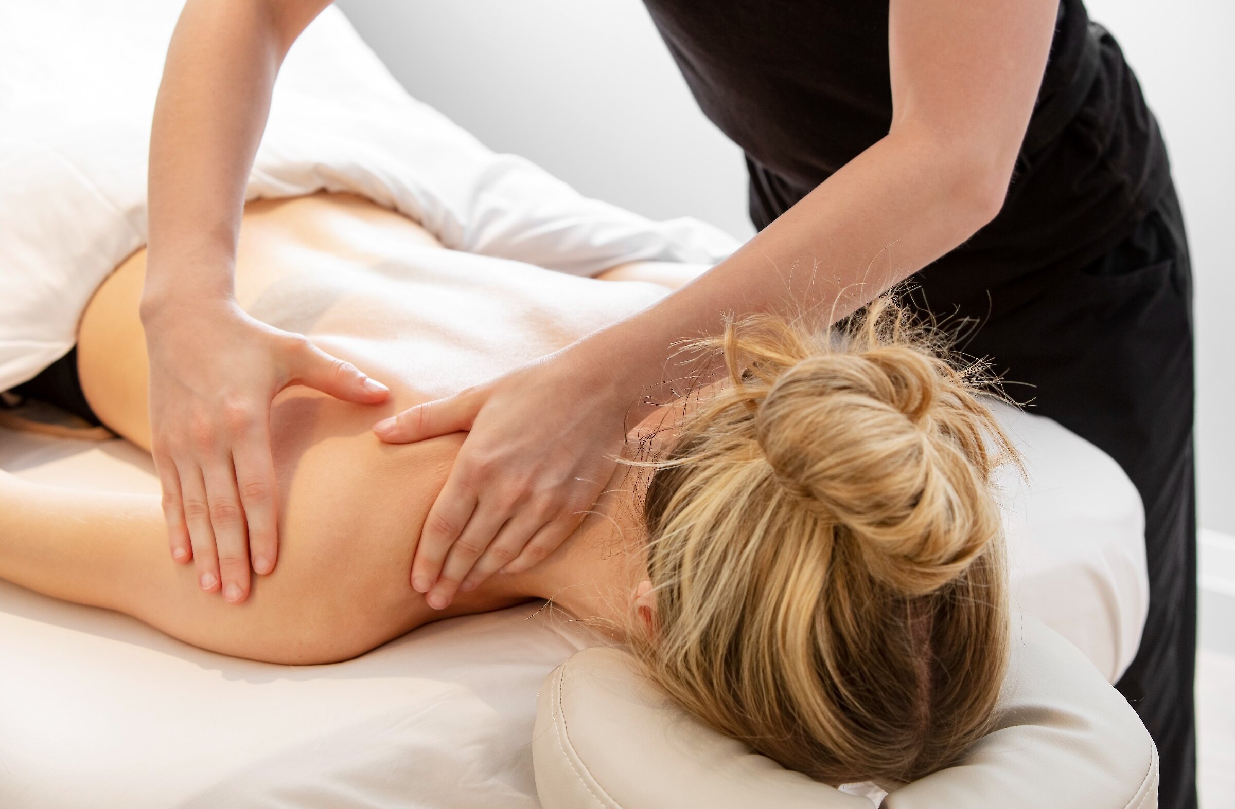 A woman gets a back massage
