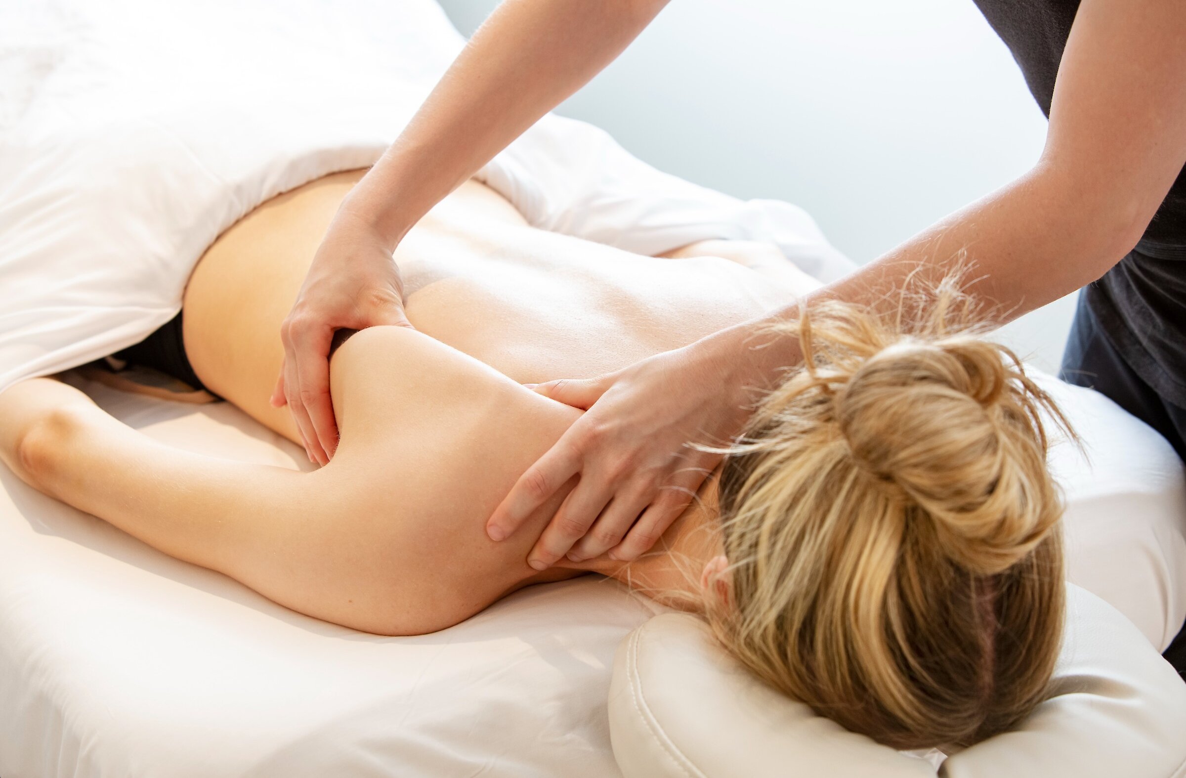 A woman gets a back massage