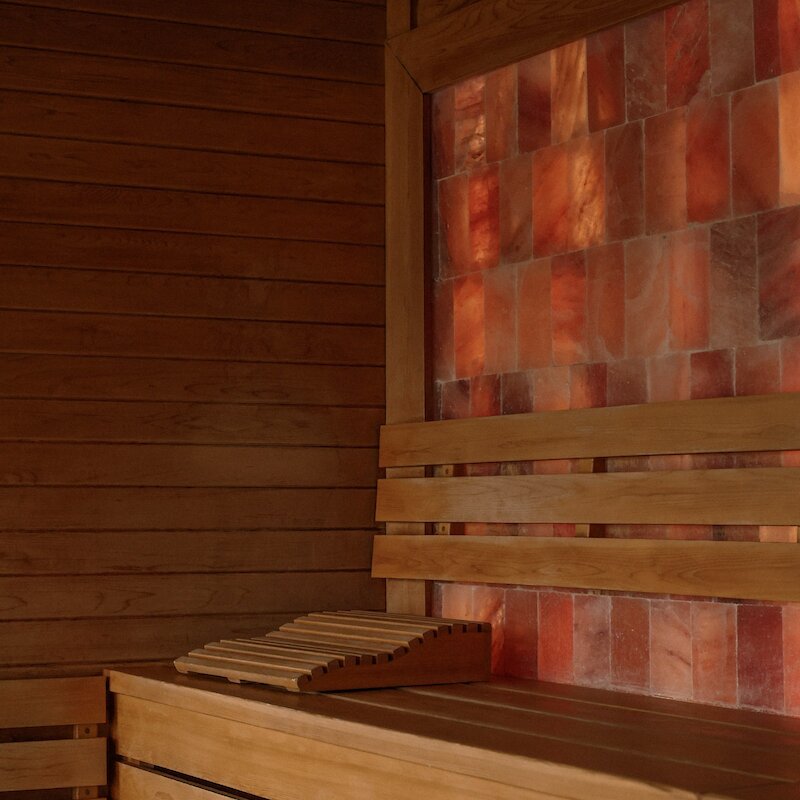 Sauna with pink and orange wall