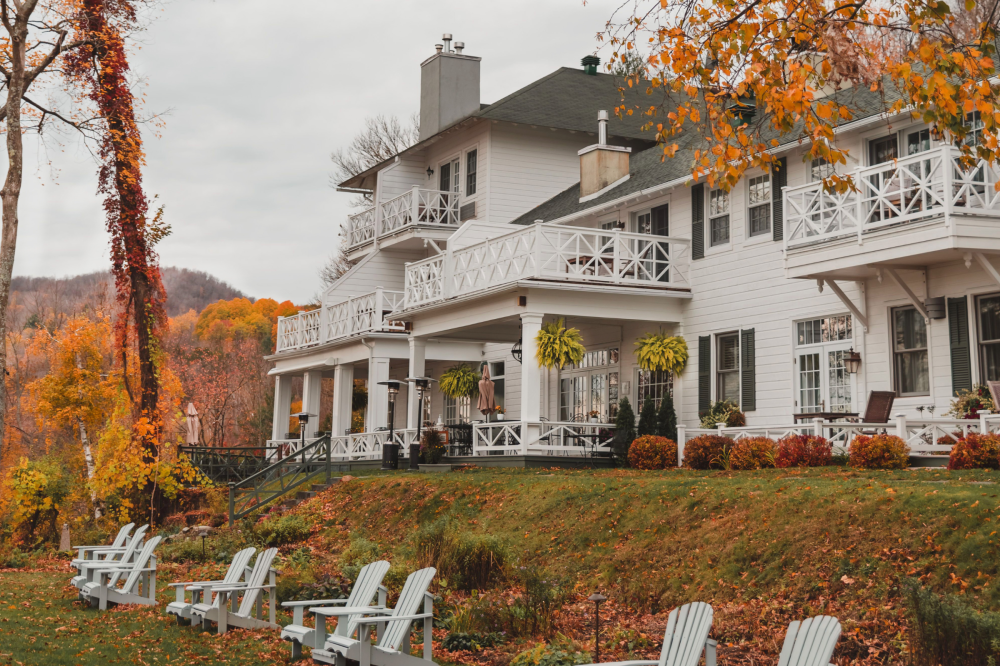 The gardens in autumn with the building and terrace in the background