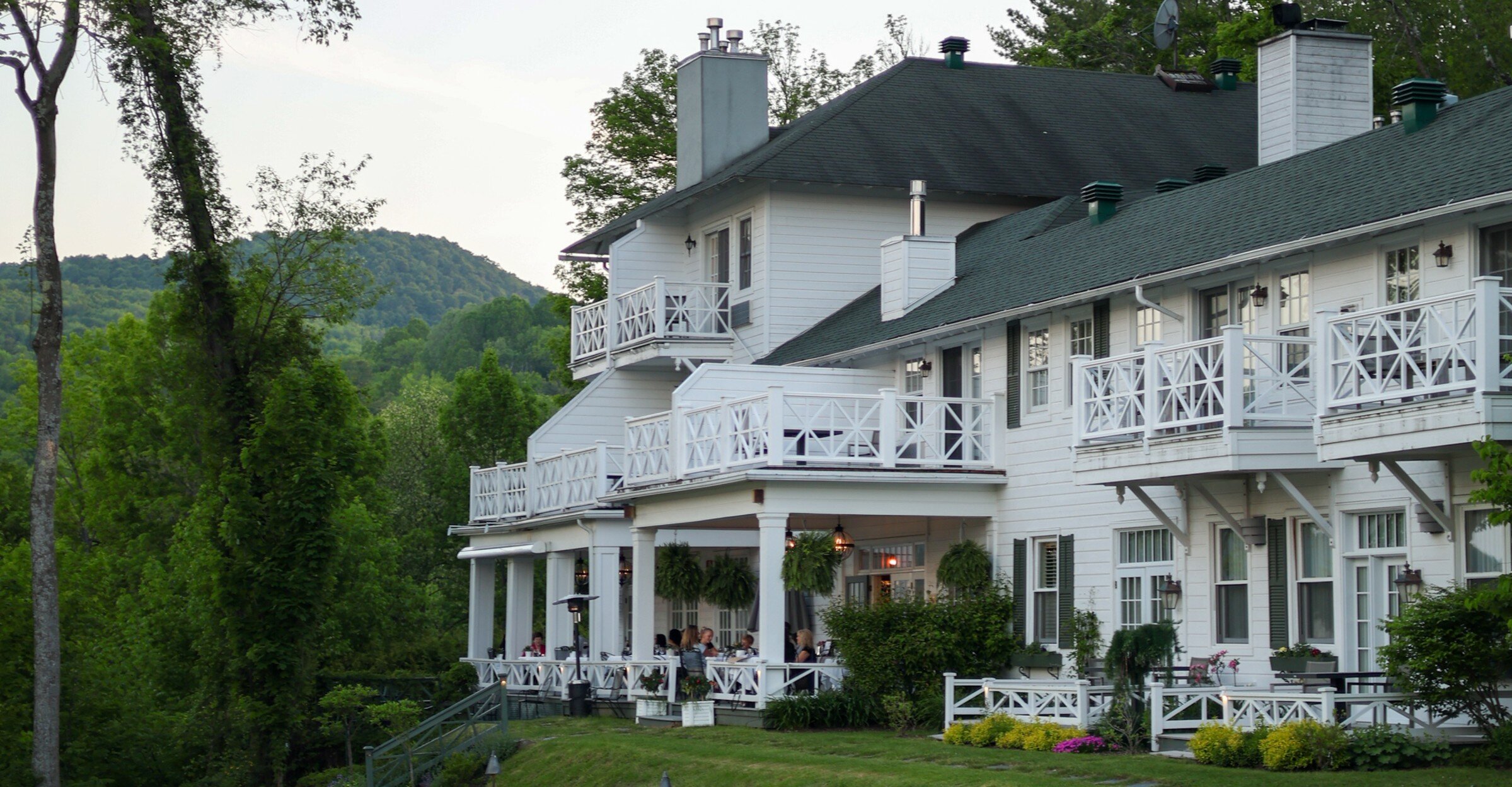 Historic lakeside estate surrounded by gardens and rolling hills in the Eastern Townships.