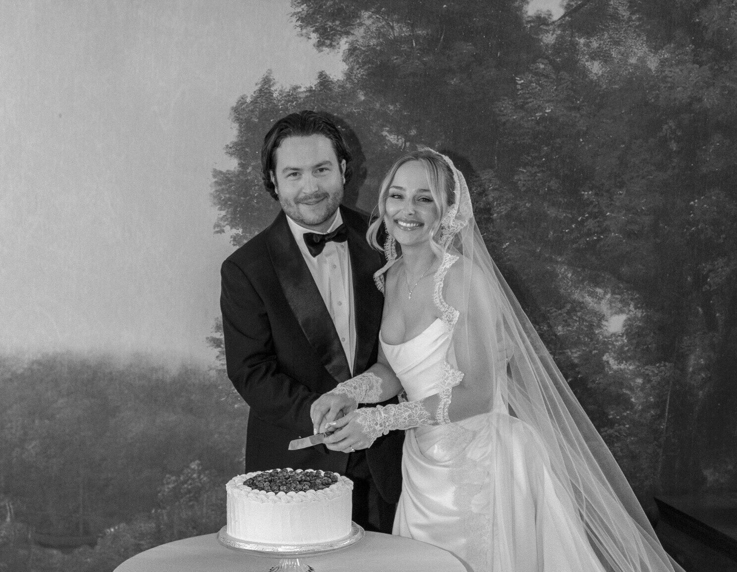 Bride and groom cutting their wedding cake.
