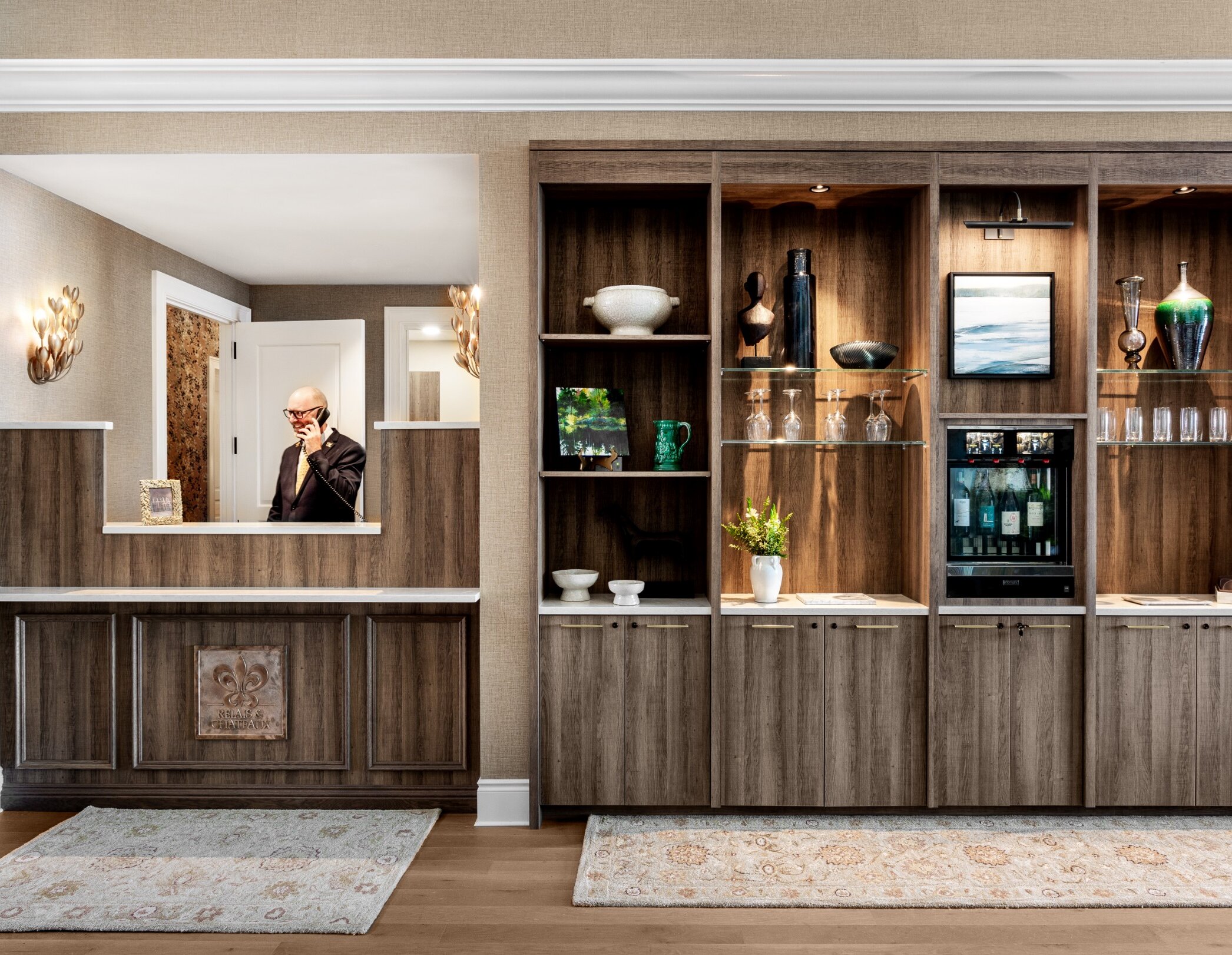 An employee at the hotel reception desk